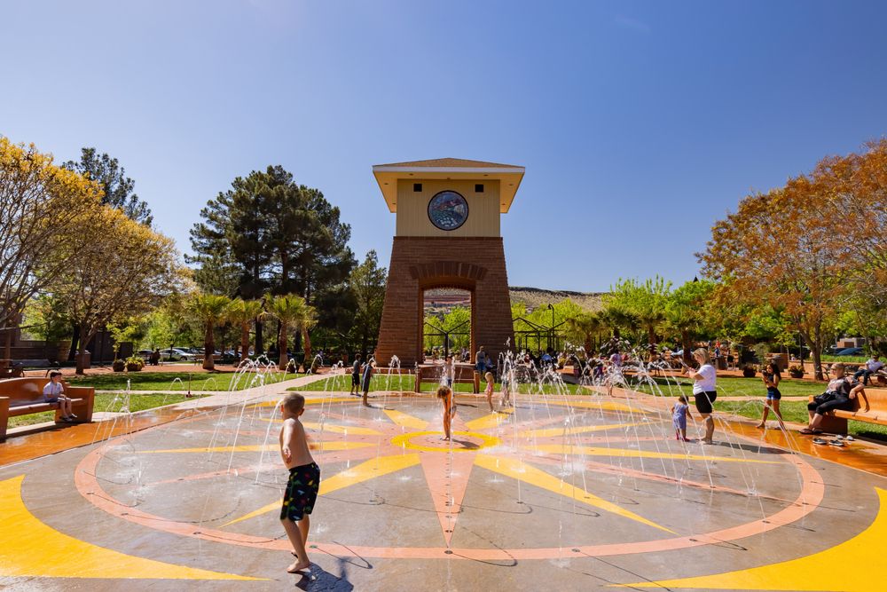 People at the Historic Town Square splash pad