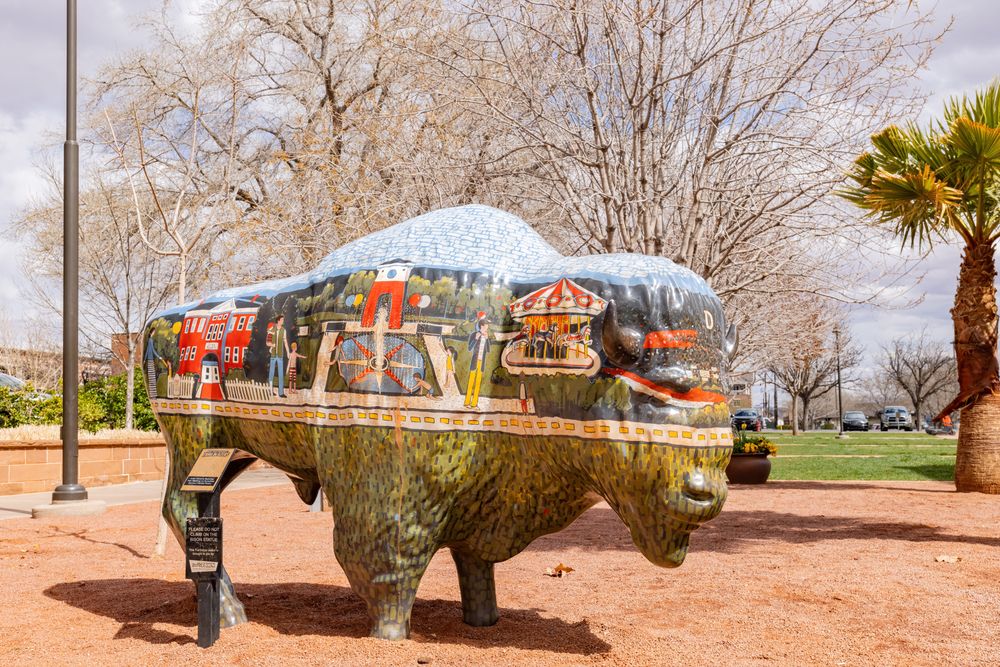An animal sculpture with a mural at the Historic Town Square