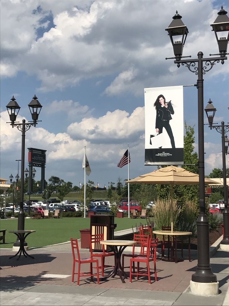 Tables and chairs on the grounds of Gloucester Premium Outlets