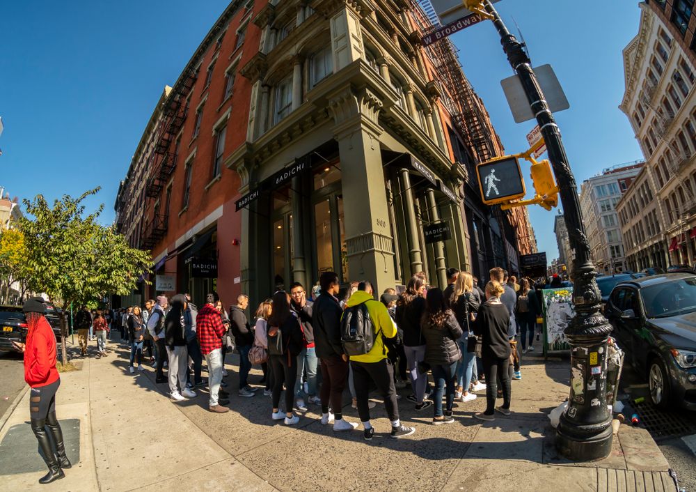 People line up outside a pop-up store