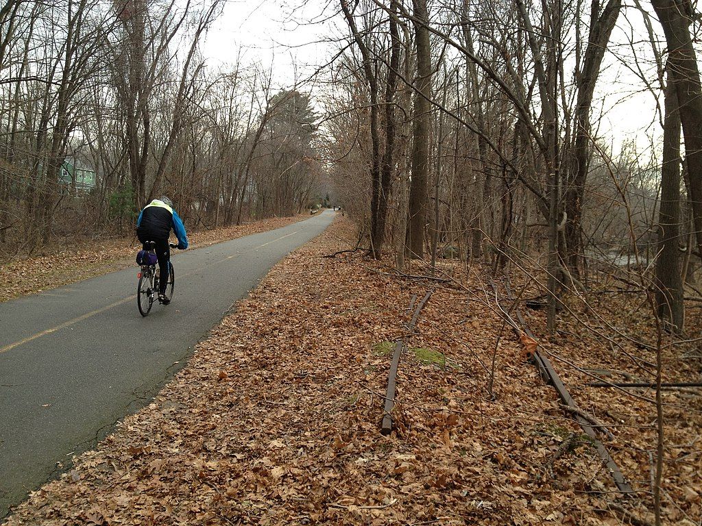 A person riding a bike along Minuteman Commuter Bikeway