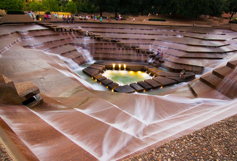 People admiring the unique Fort Worth Water Gardens