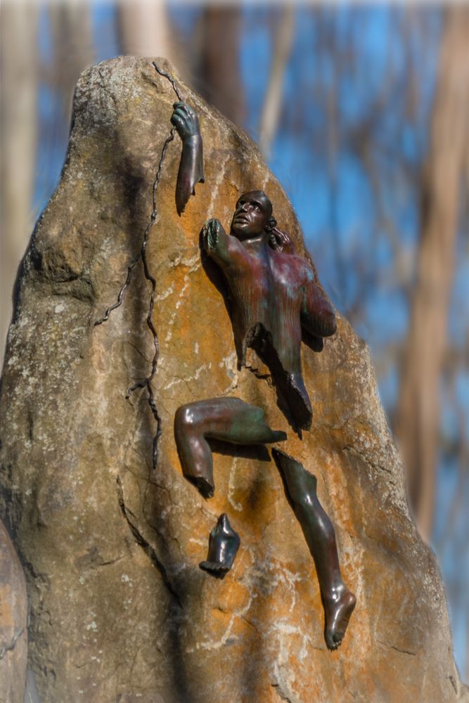 A rock with a bronze figure at Avalon Nature Preserve