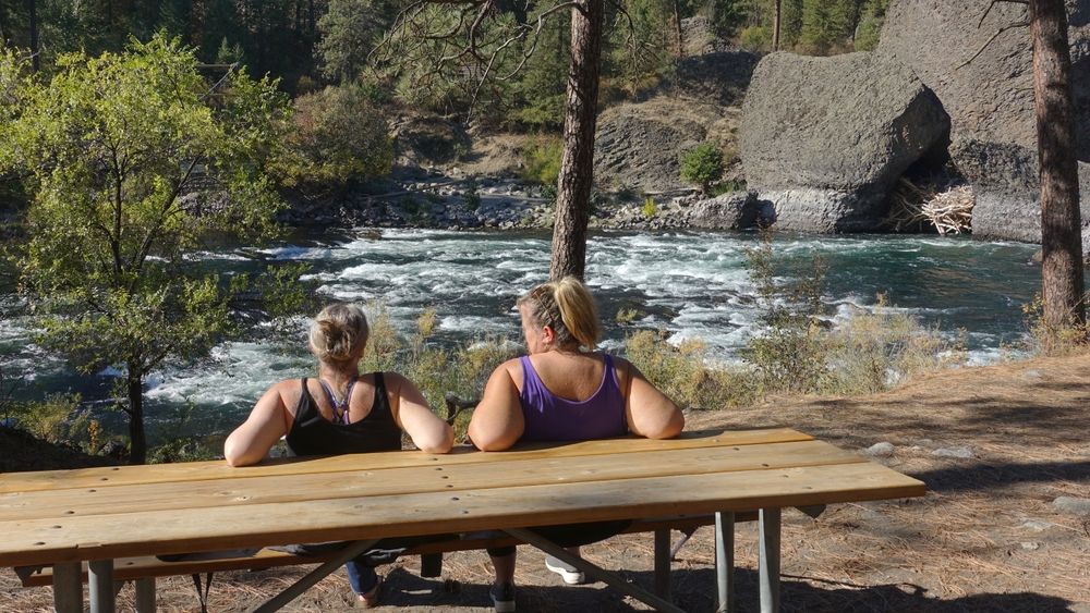 Women admiring the views from a bench at Riverside State Park
