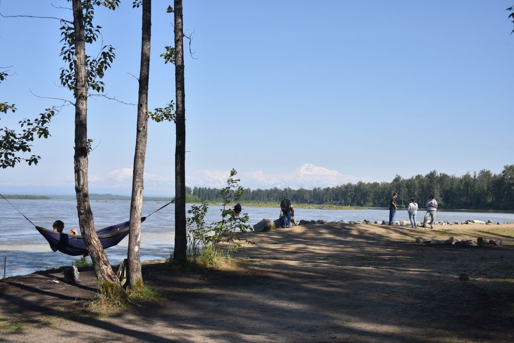 People near the waters of Susitna River