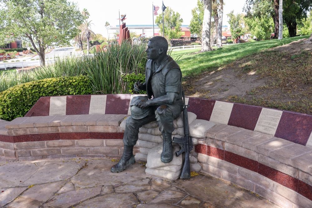 Soldier writing a letter statue at Temecula Duck Pond & Veterans Memorial
