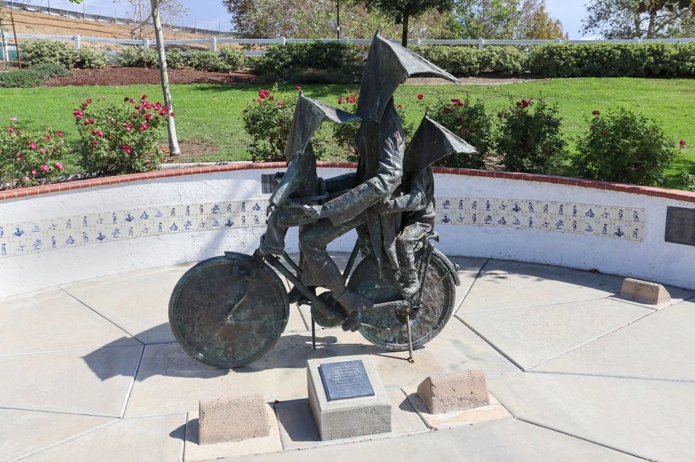 Mother and child riding a bike statue at Temecula Duck Pond & Veterans Memorial