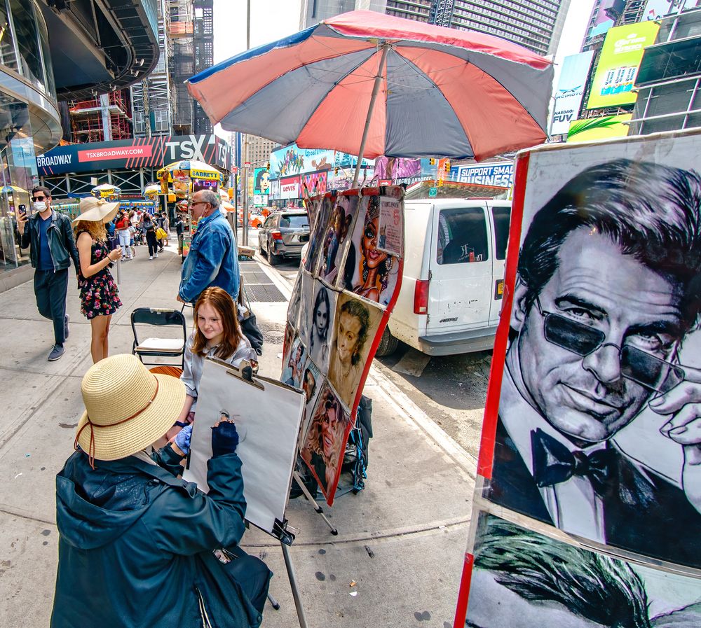 A girl posing for a sketch at Times Square