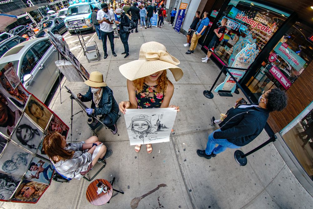 A person holding a Street Artist sketch