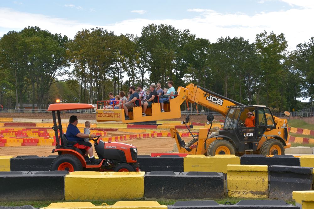 People operating Diggerland USA tractors