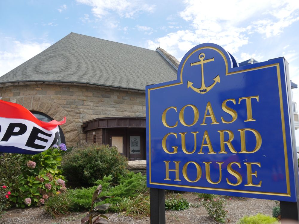 Welcome sign of the Coast Guard House Restaurant