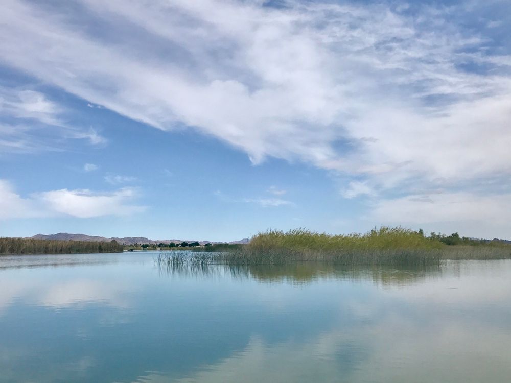 The sky reflecting on the calm Martinez Lake